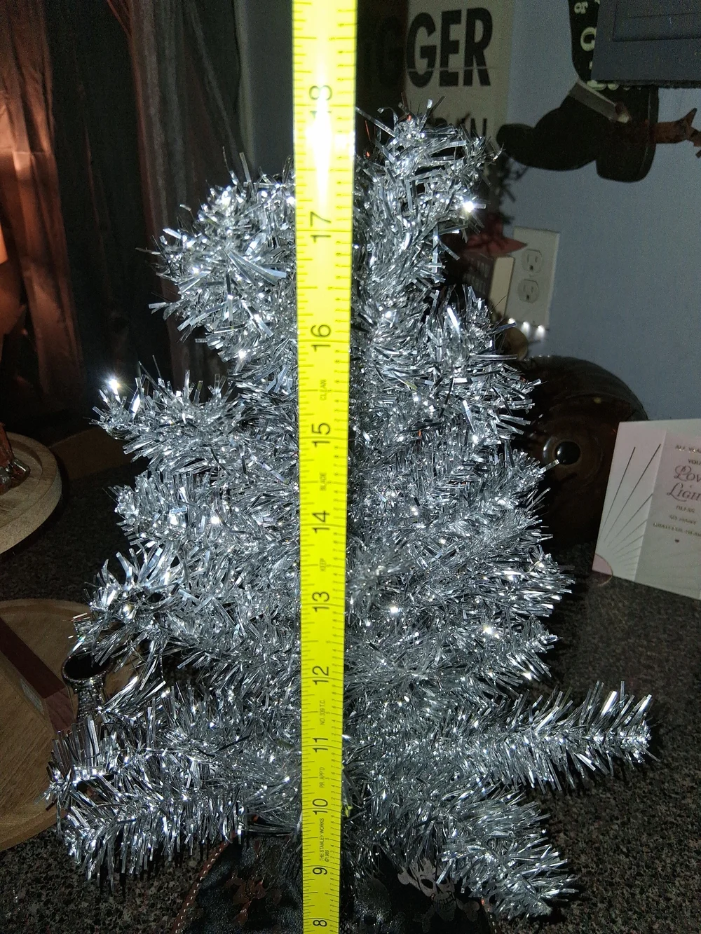 Silver Tinsel Holiday Tree with Black Skull Tree Skirt